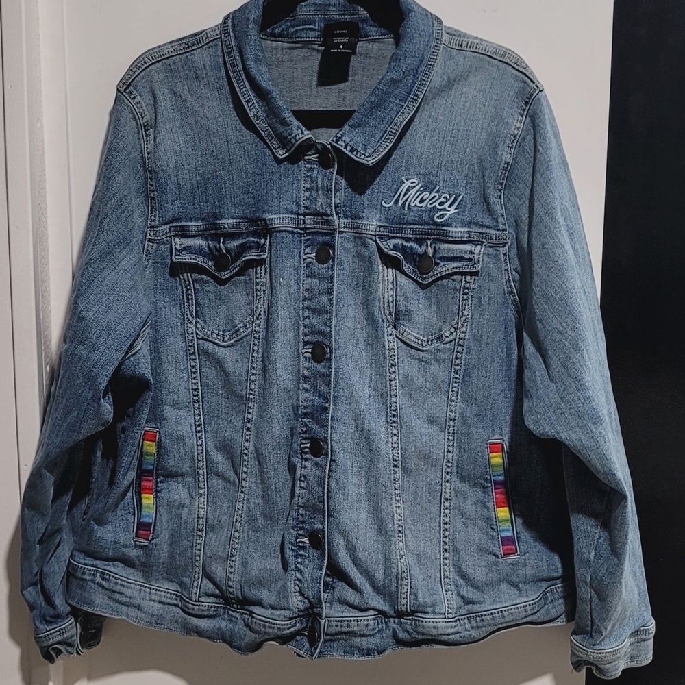 Torrid Brand Mickey Mouse denim jackTorrid Blue with pastel Rainbow Details.